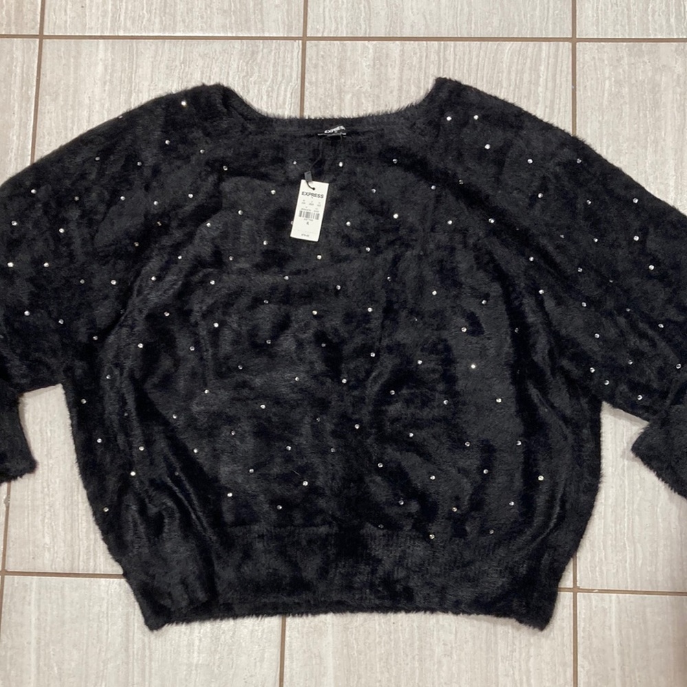 Woman’s Express sweaters with bling